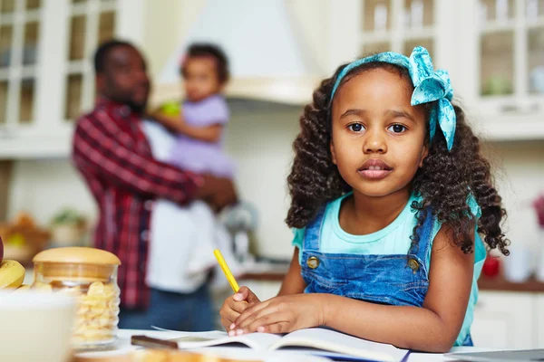 African-American girl  doing home assignment