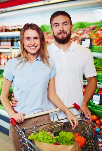 Couple buying products in supermarket