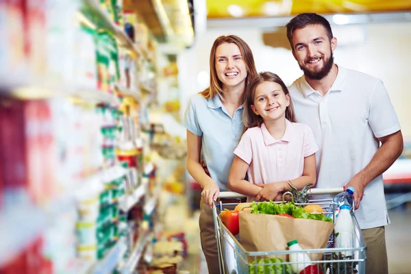 Family buying food in supermarket