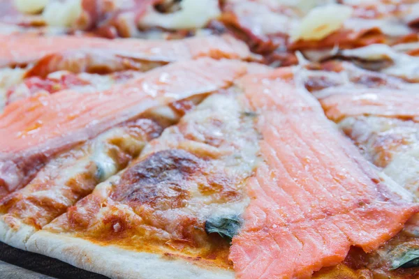 Pizza Hawaiian and Salmon pizza
