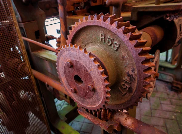 Old and rusty pinion gear of a machine in factor