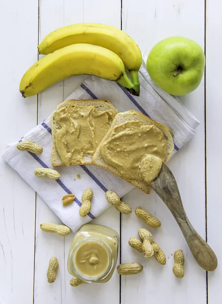 Peanut butter spread with banana and apple