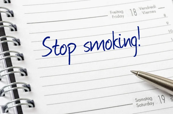 Stop smoking written on a calendar page