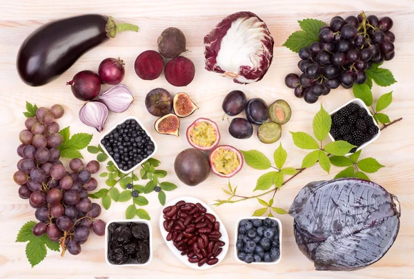 Purple fruit and vegetables, top view