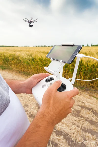 Unmanned copter. Man controls quadrocopter flight.