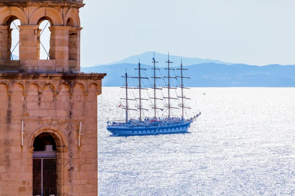 Old town Dubrovnik on the Adriatic Sea background with ship.