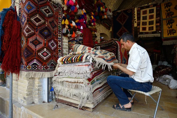 Traditional iranian carpets in a market, Iran