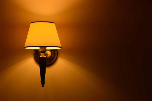 Hanging lamp lit wall in natural light