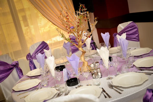 Wedding table with plate, napkin, cutlery on mauve color