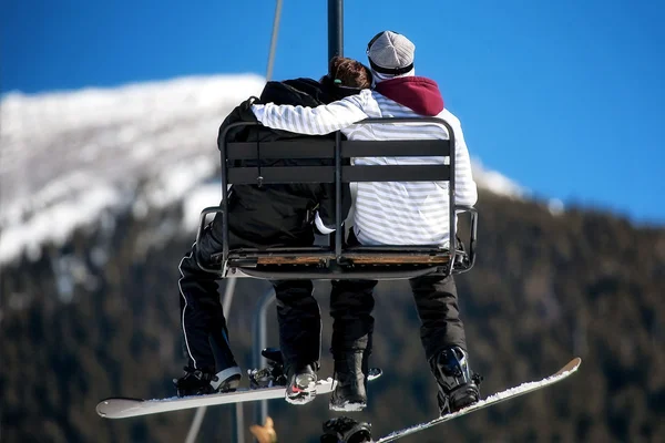 Couple embracing on Ski Lift