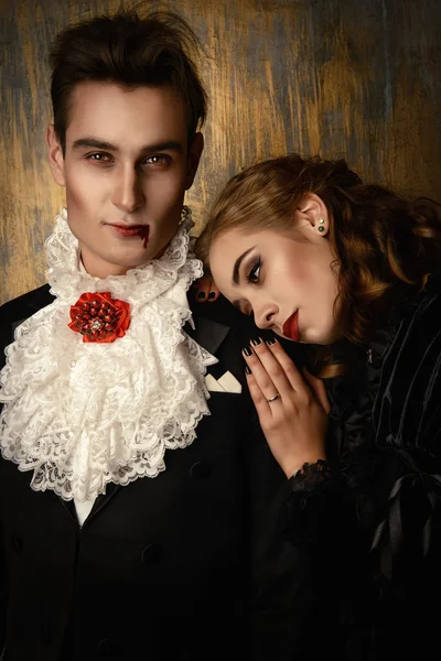 Immortal. Beautiful couple of vampires dressed in medieval clothing.