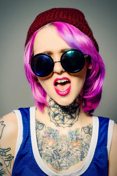 Cool youth. Tattoo style. Hair coloring.