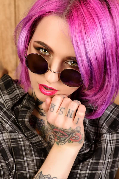 Attractive girl . Optics style. Tattoo.