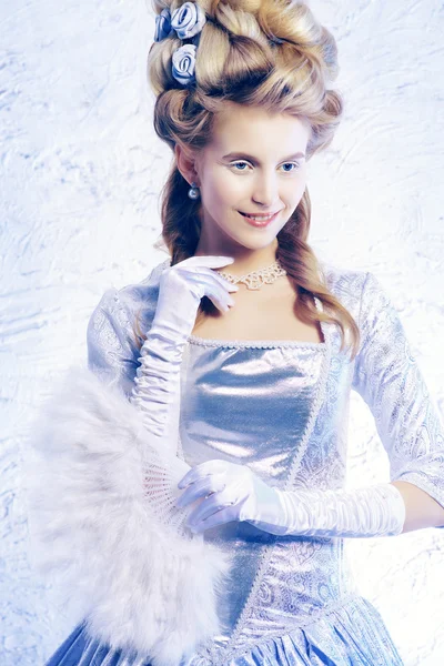 Winter lady. Elegant Ice Queen over frozen background..