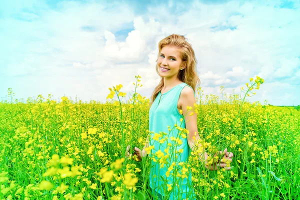 Yellow meadow. Happy romantic girl.