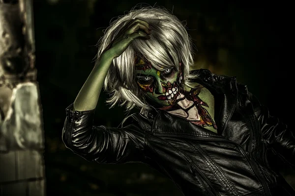 Bloodthirsty zombie. Halloween make-up.