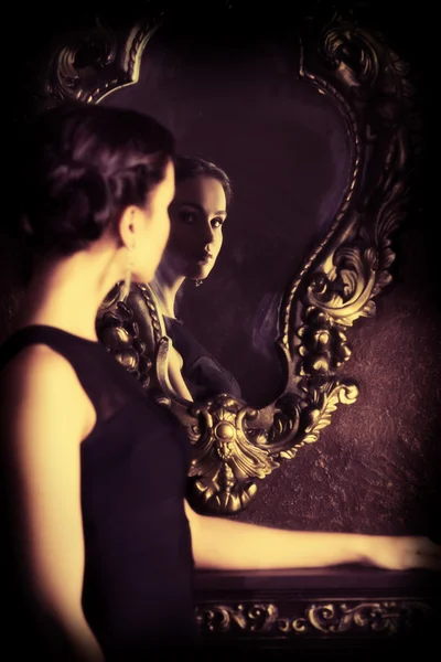 Looking into mirror