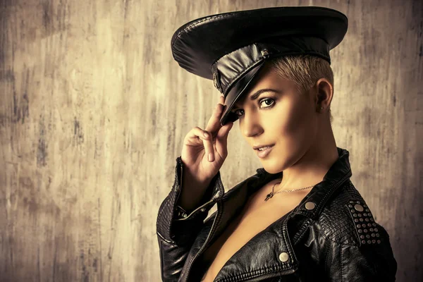 Young woman alluring in a costume of police officer