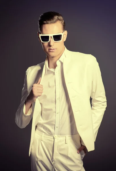 White suit. Studio fashion shot.