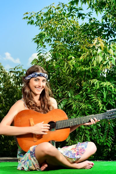 Hippie lifestyle,  girl playing the guitar