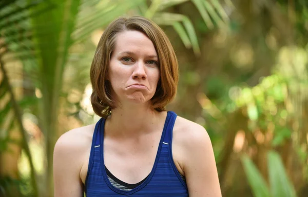 Woman with frown after receiving bad news