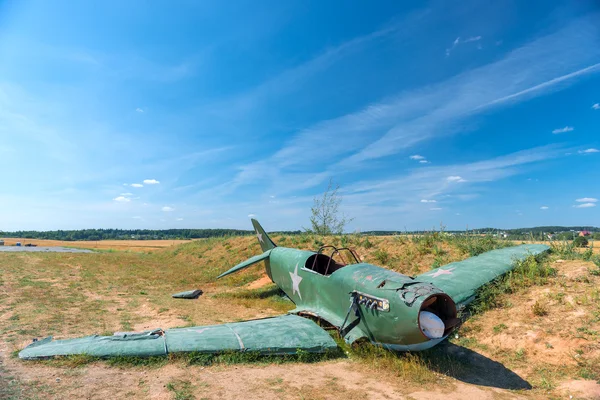 The remains of the crashed military aircraft in the field