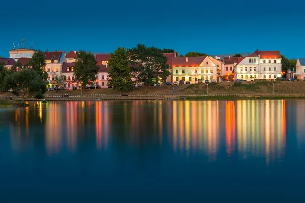 Beautiful houses on the river bank at sunset