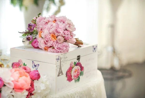 Wedding decoration on table. Floral arrangements and decoration. Arrangement of pink and white flowers in restaurant for luxury wedding event