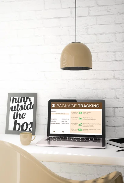 Desktop with laptop showing package tracking