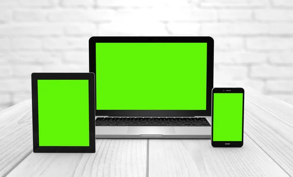 Laptop, tablet and smartphone with green screen