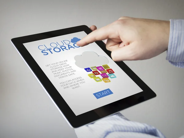 Hands with tablet with cloud storage