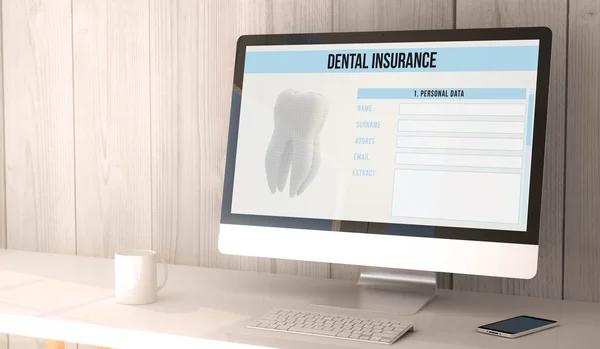 Computer and smartphone with dental insurance on the screen