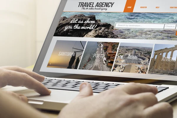 Man using a laptop with travel agency