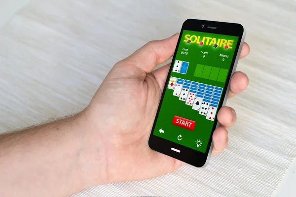 Smartphone with solitaire app on the screen