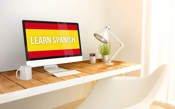 Minimalist workplace with learn spanish computer