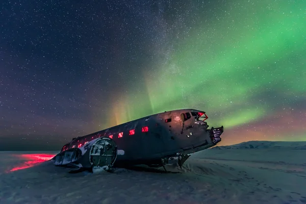 Northern lights over plane wreck