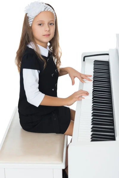 The girl plays the piano