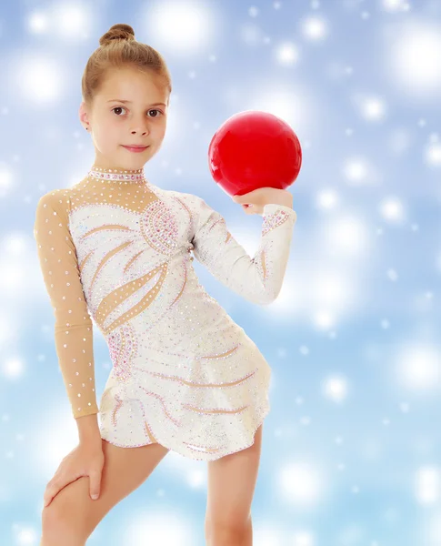 Little gymnast with a ball