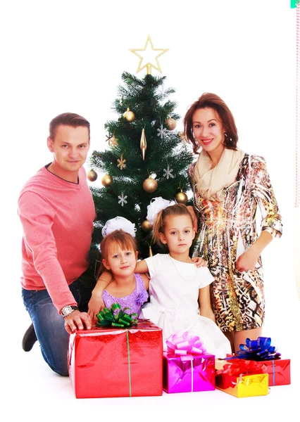 Happy family at Christmas tree
