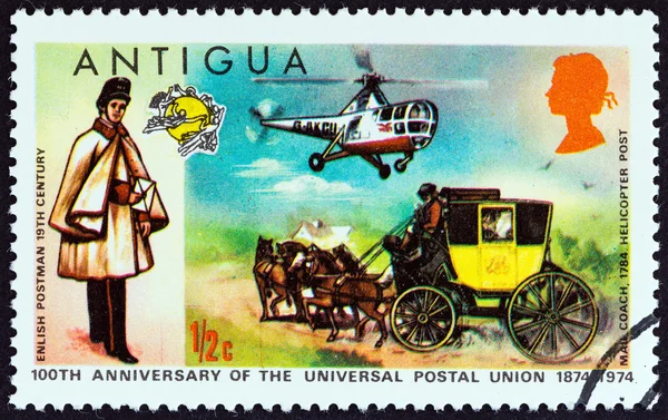 ANTIGUA - CIRCA 1974: A stamp printed in Antigua issued for the Centenary of U.P.U. shows English Postman, Mailcoach and Westland Dragonfly Helicopter, circa 1974.