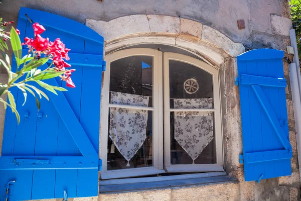 Window with flowers in old house, Provence, France