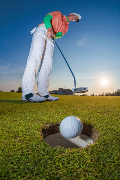 Man playing golf