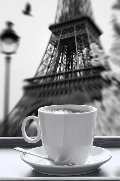 Eiffel Tower with cup of coffee in black and white style, Paris, France