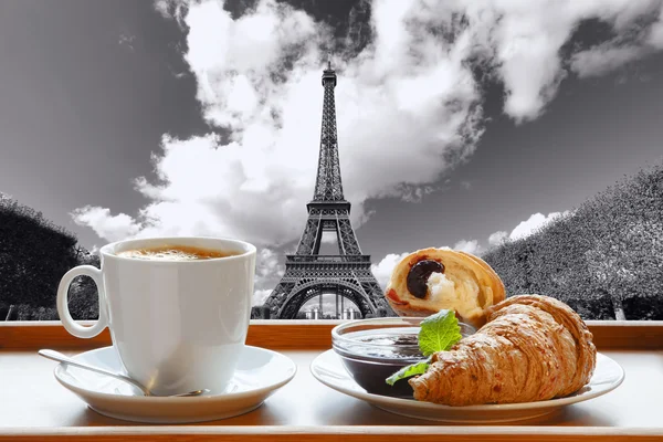 Coffee with croissants against Eiffel Tower in Paris, France