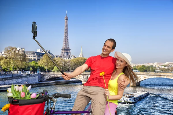 Couple Taking Selfie by Eiffel Tower in Paris, France