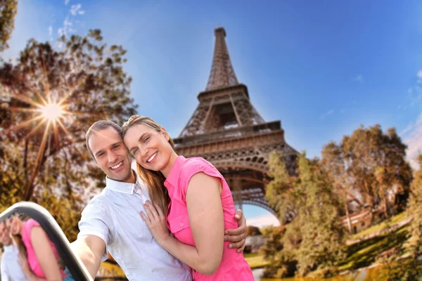Couple Taking Selfie by Eiffel Tower in Paris, France