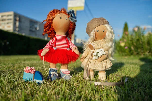 Two handmade dolls with natural hair