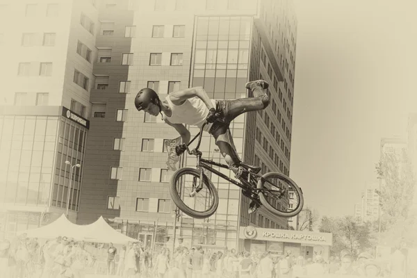 BMX cyclist performs a stunt jump