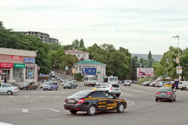 Taxi at the roundabout road junction in the centre of the city