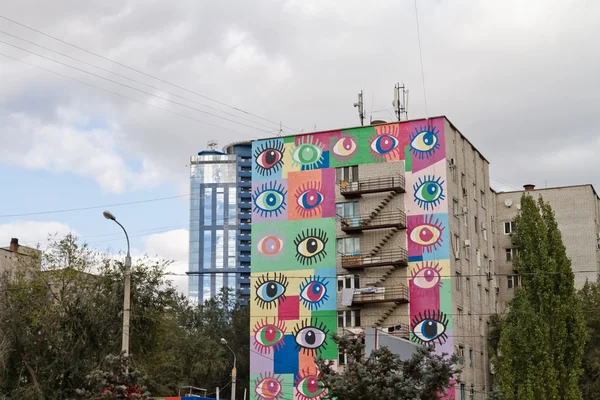 Colored eyes painted on facade of building